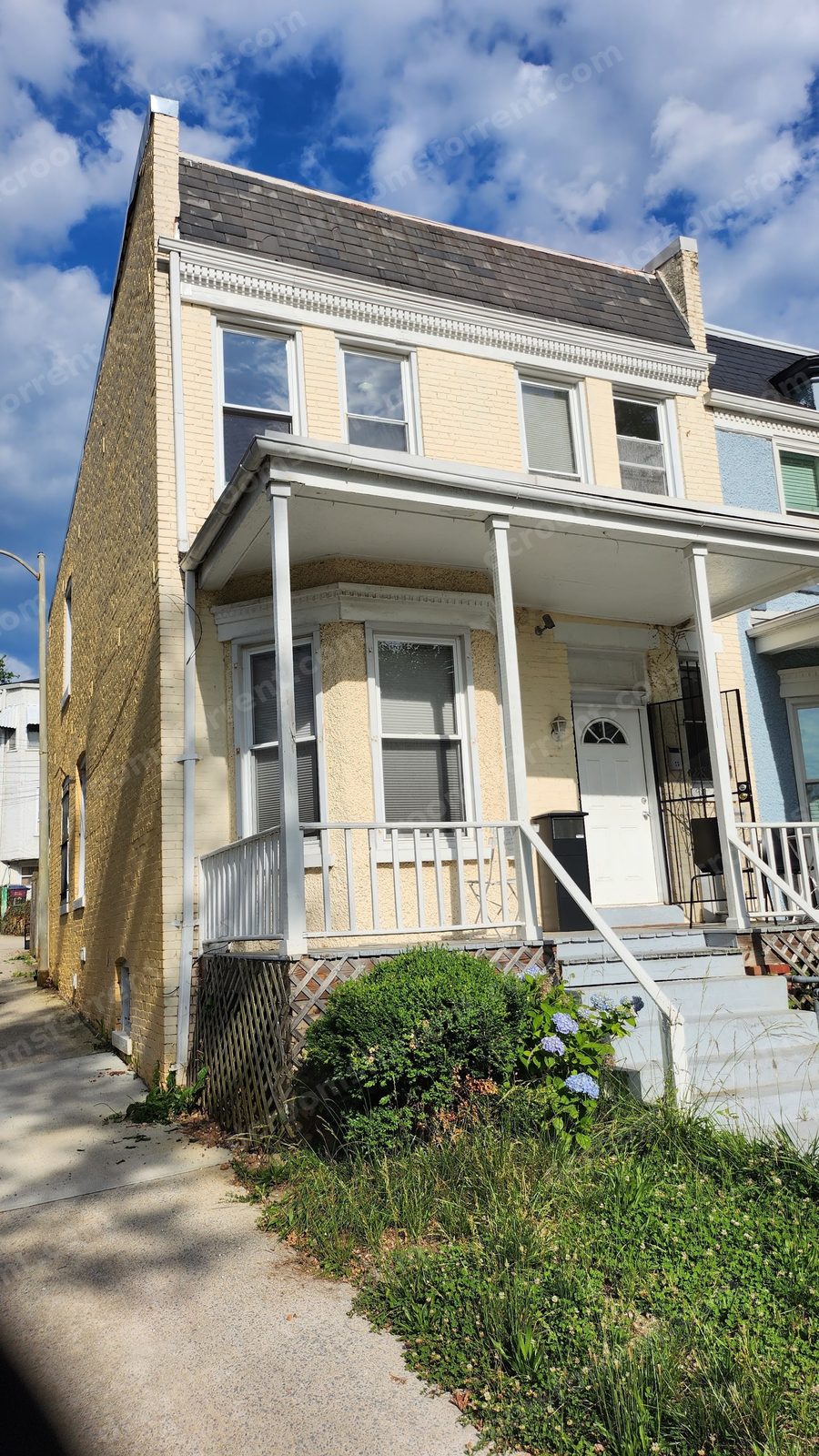 Front porch of the Marlboro house with bay window