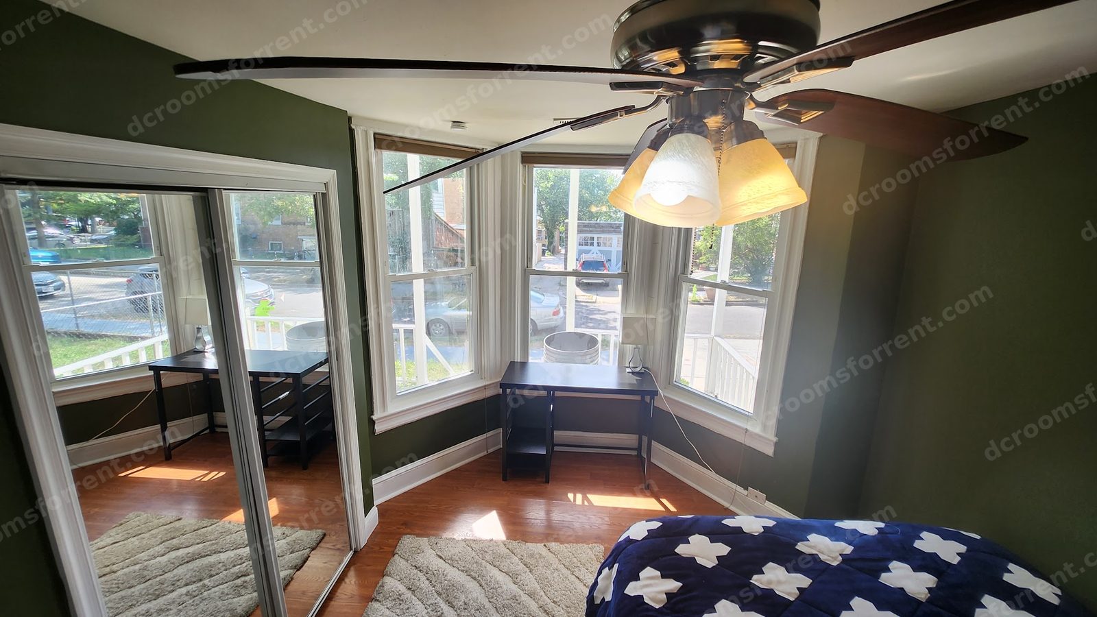 Delta Room: bed and mirrored sliding closet doors