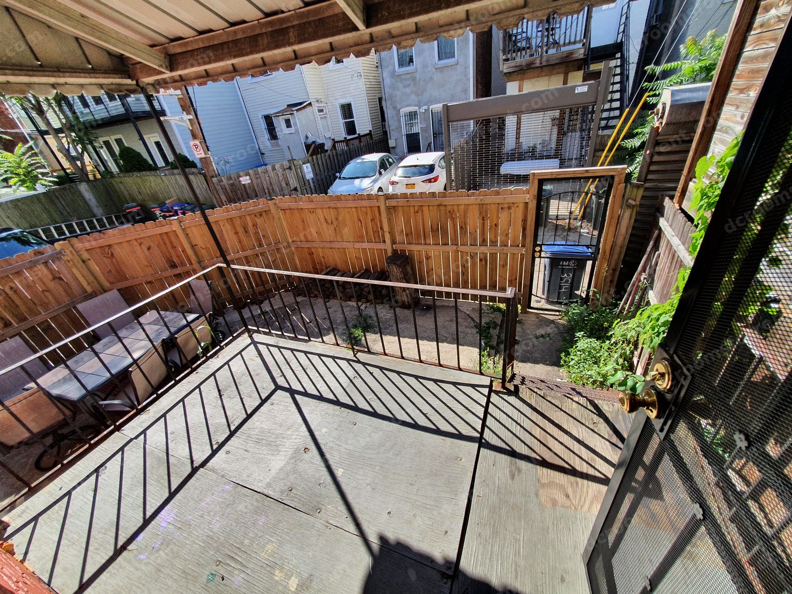 Back porch deck overlooking the fenced backyard.